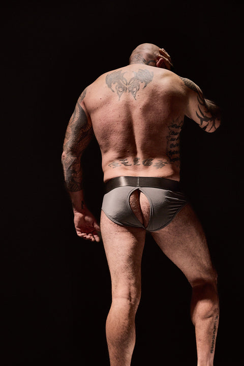 inked man wearing grey underwear